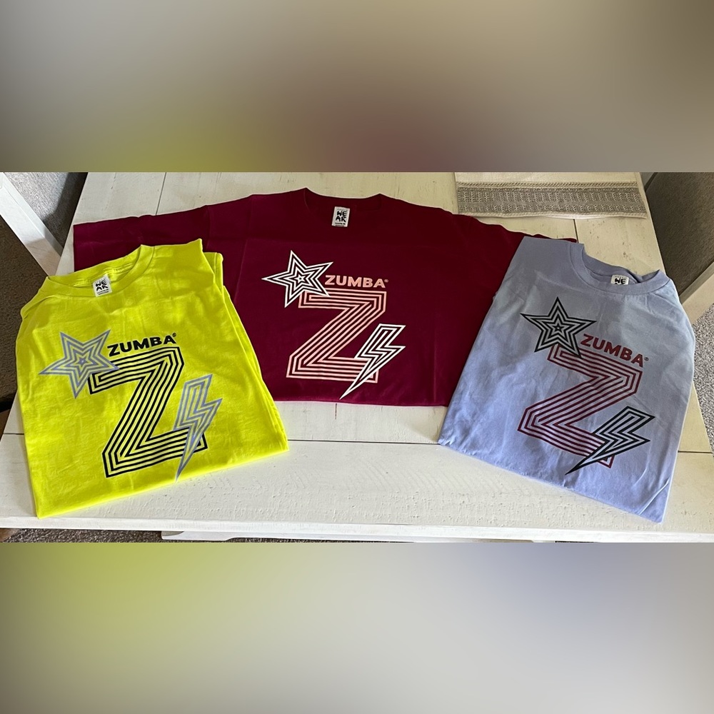 SS Zumba tee, Burgundy pictured. New in package. All one size. Un…